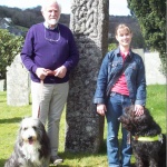 Tony Susan and dogs by carved stone